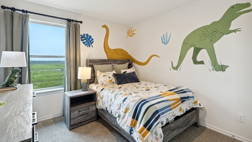 2110 Woodrose Court two-story model at Cartwright Ranch in Crandall, TX secondary bedroom with carpet and windows