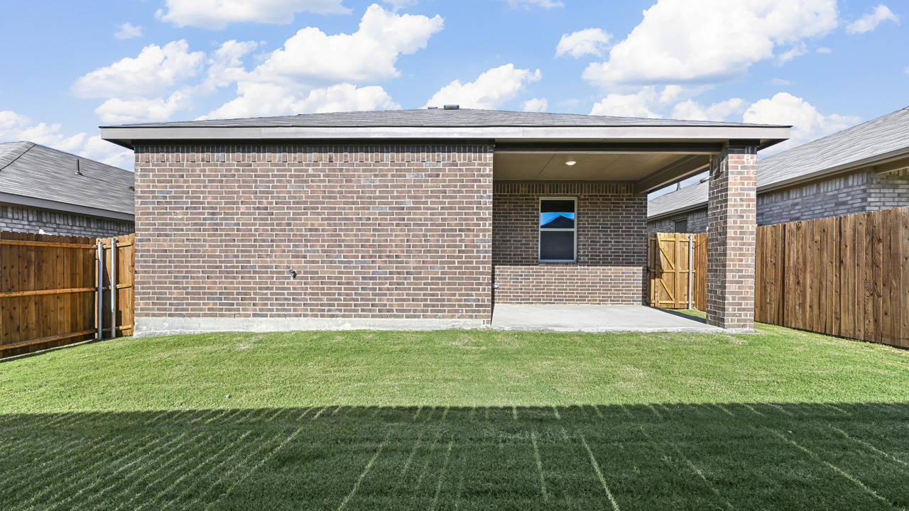 an empty bedroom with white walls and gray carpet