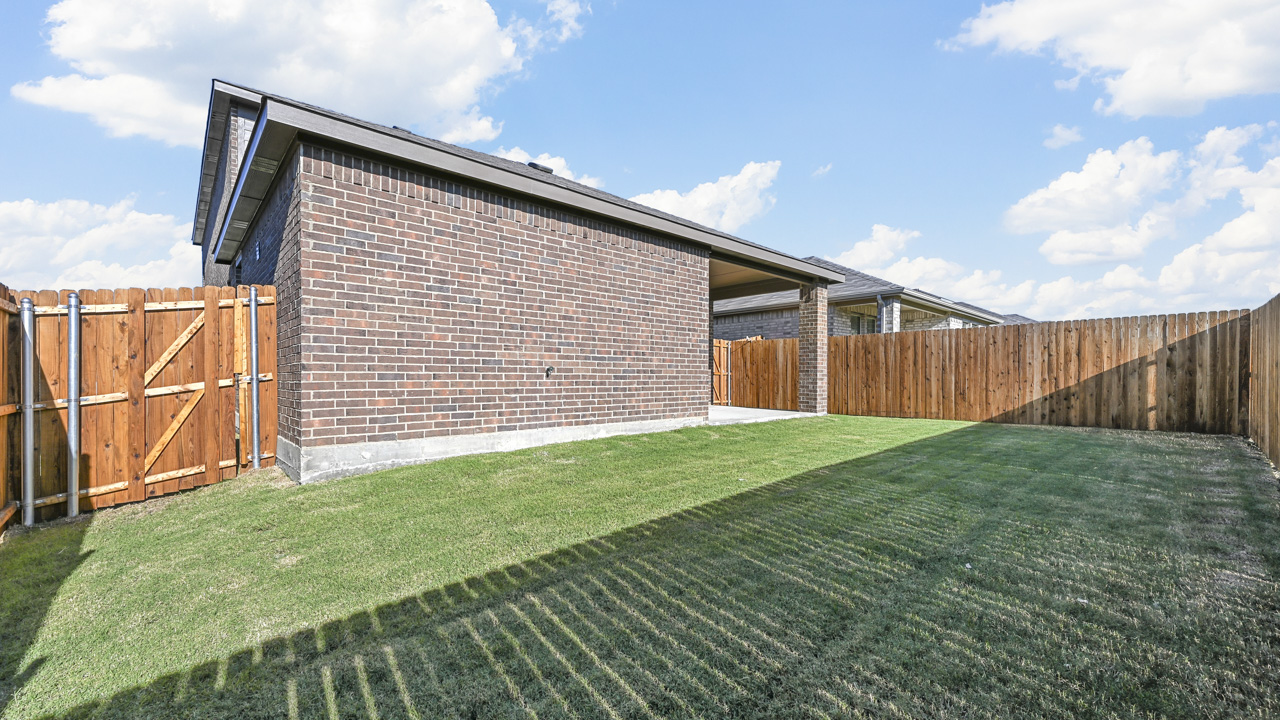 an empty bedroom with white walls and gray carpet