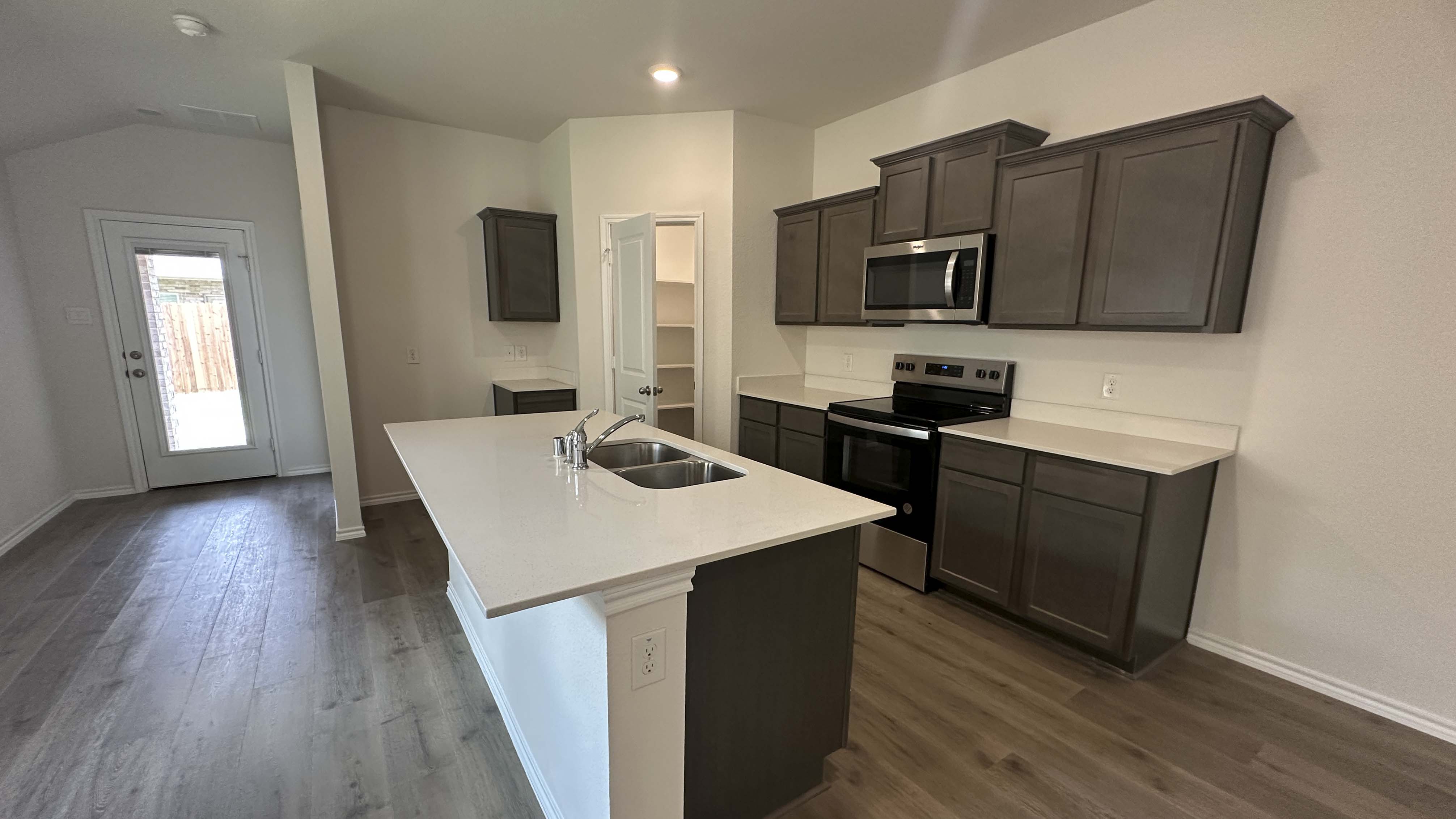 kitchen area with hardwood floors