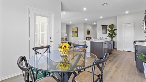 DIning area with open concept view into the living room