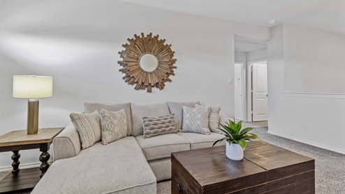 Upstairs media room with windows and furnishings