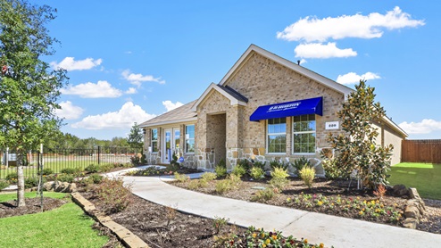 One story model with blue DR Horton awning and beautiful landscaping