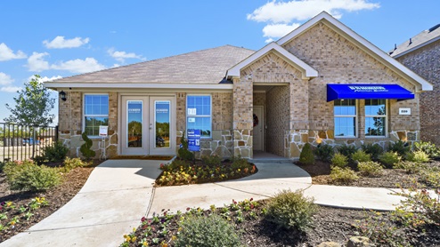 One story model with blue DR Horton awning and beautiful landscaping