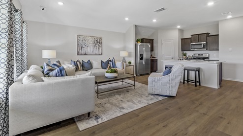 Living room with open concept area view into kitchen