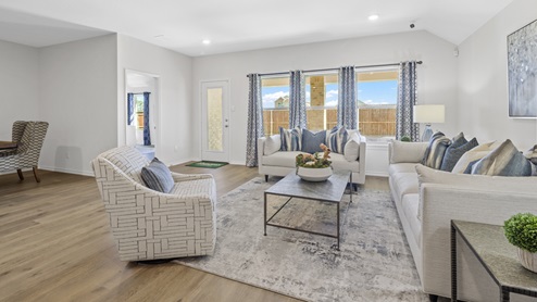 Living room with beautiful furnishings and large windows