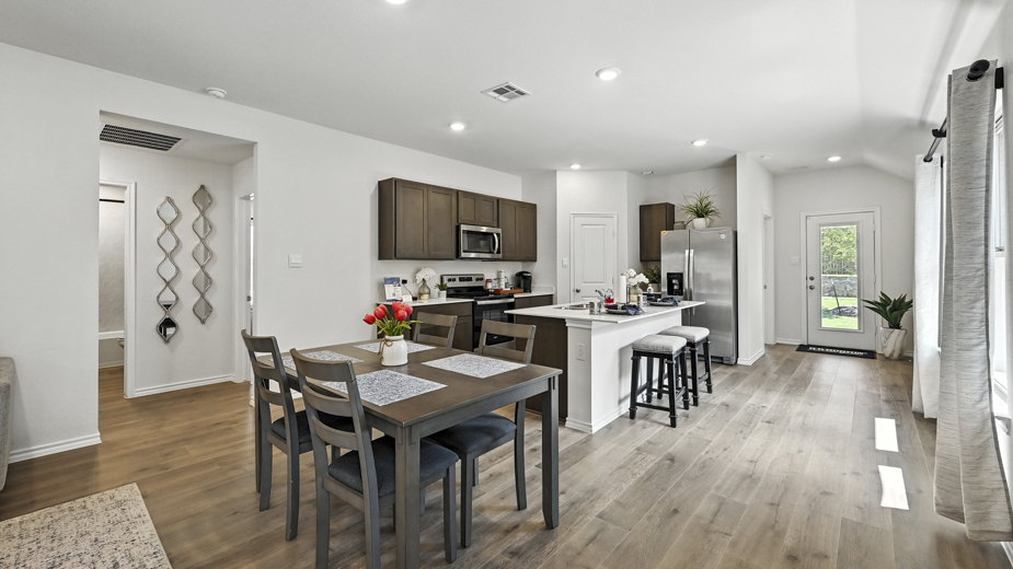 Open concept first floor with the living room, dining room and kitchen next to each other