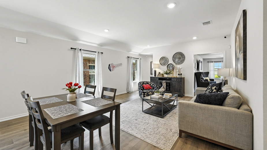 Open concept first floor with the living room, dining room and kitchen next to each other