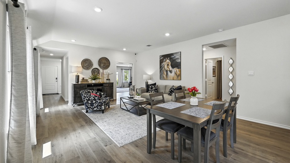 Open concept first floor with the living room, dining room and kitchen next to each other