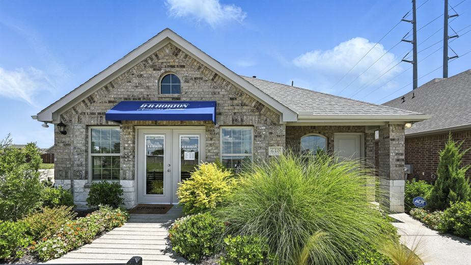 front exterior of a home with stone exterior and brown siding