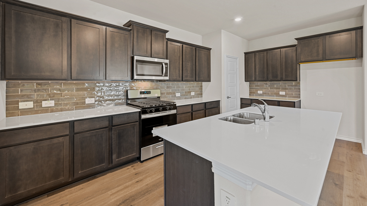 kitchen with dark brown cabinets