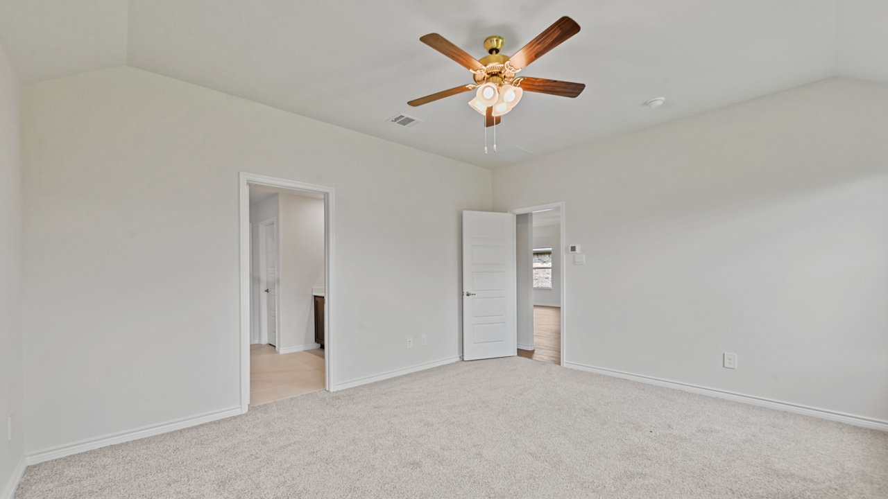 primary bedroom with grey carpet