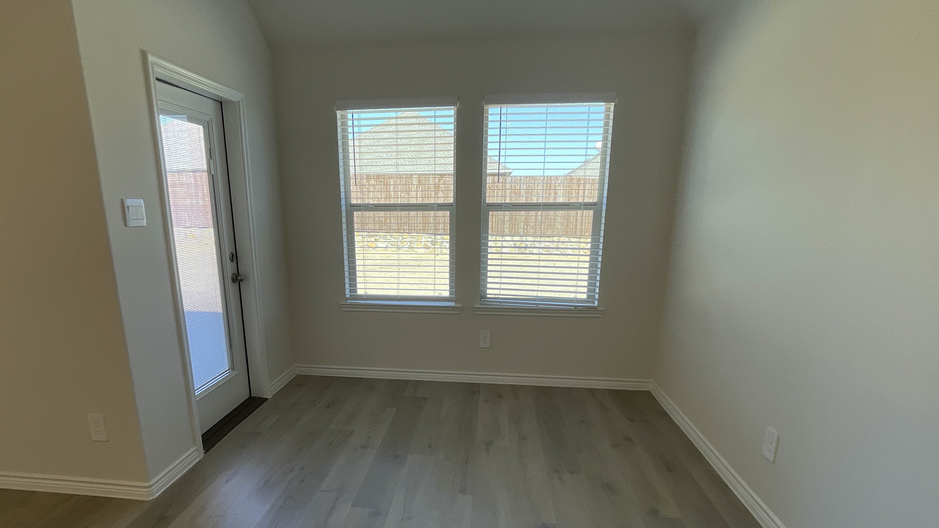 dining area with windows facing the backyard