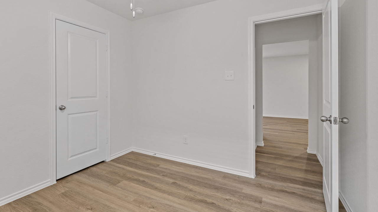 bedroom with wood floors