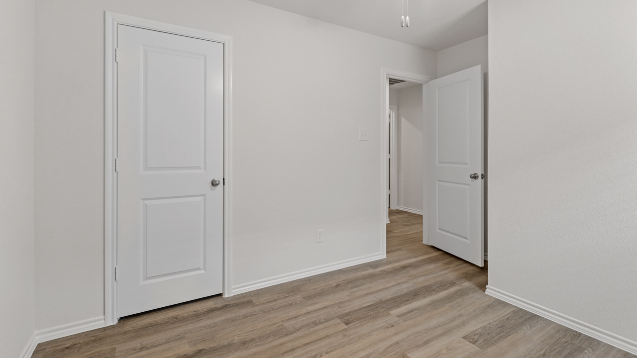 bedroom with wood floors
