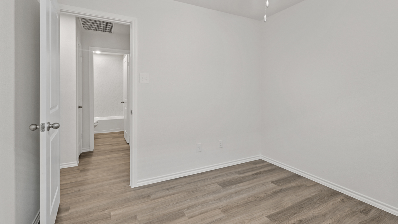 bedroom with wood floors