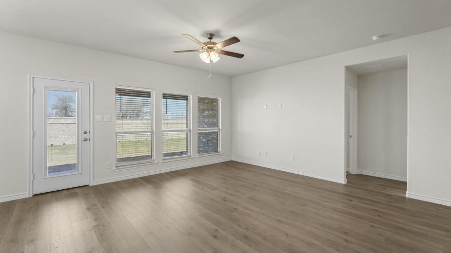 living area with wood floors and windows
