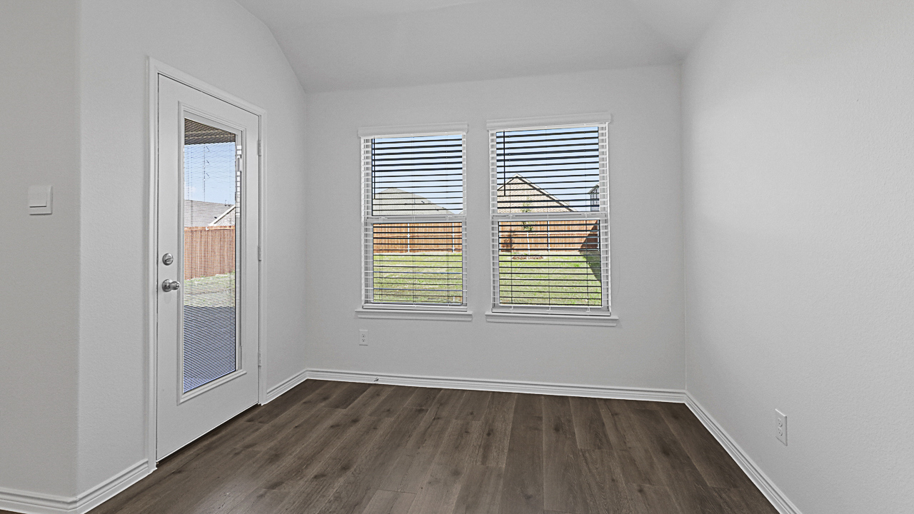 open breakfast nook with wood flooring