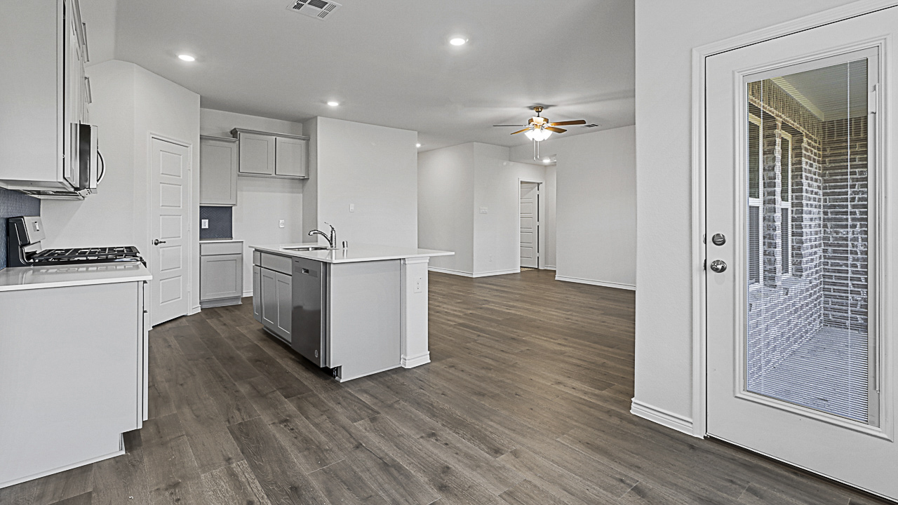 open kitchen with wood flooring