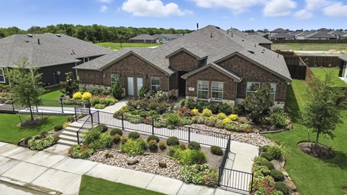 Arial view of exterior of home and street view.