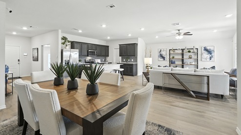 Bright dining area with neutral walls off the living room.