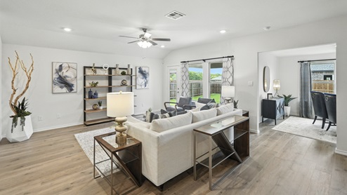 Open concept living space with natural light and simple furnishings.