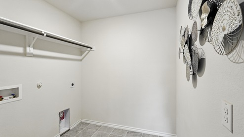 Spacious walk in closet with hanging rod