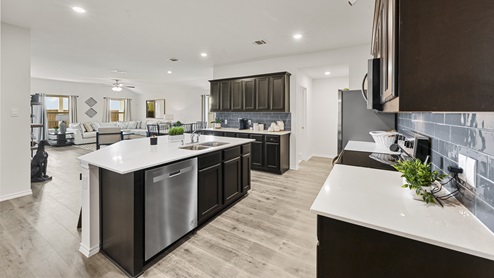 open concept large kitchen and living room with island