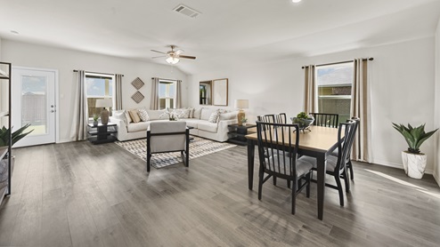 large open concept living room with windows