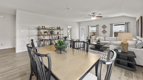 large open concept living room with windows