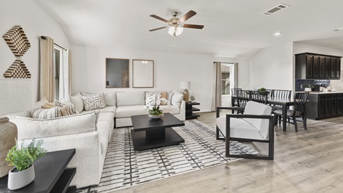 large open concept living room with windows