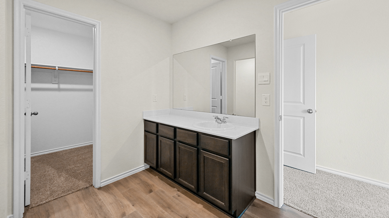 a bathroom with a walk in closet