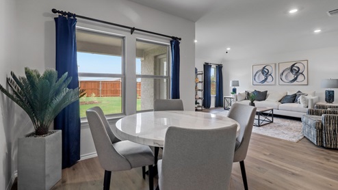 450 Lucky Lane at Bluff Springs in Ferris, TX dining and living area with hardwood floors