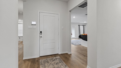 450 Lucky Lane at Bluff Springs in Ferris, TX interior entry with hardwood floors