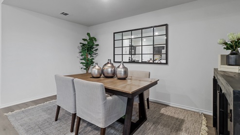 454 Lucky Lane at Bluff Springs in Ferris, TX dining area with hardwood floors