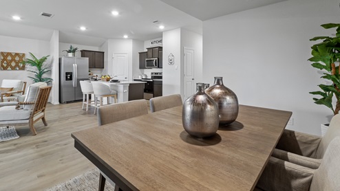 454 Lucky Lane at Bluff Springs in Ferris, TX dining area with views of the kitchen
