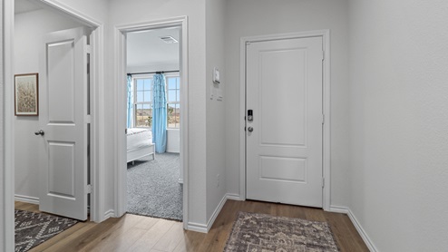 454 Lucky Lane at Bluff Springs in Ferris, TX interior entrance with hardwood floors