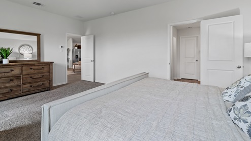 454 Lucky Lane at Bluff Springs in Ferris, TX primary bedroom
