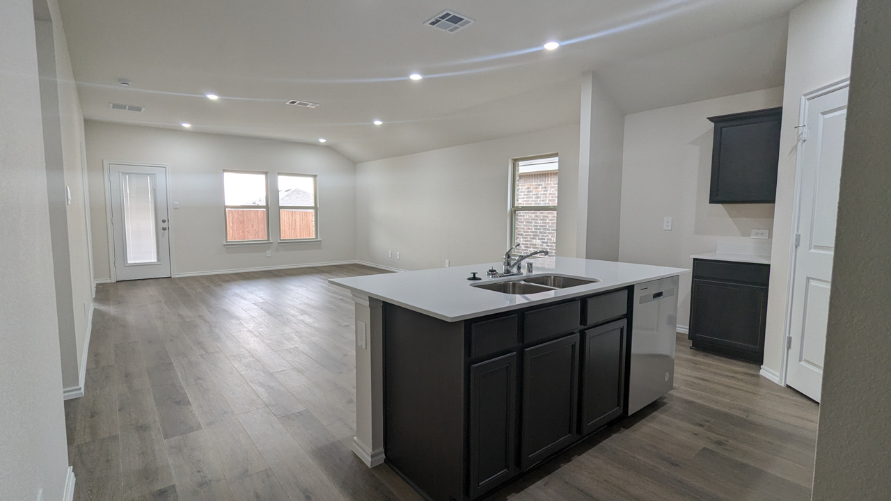 open concept living area with view of the kitchen