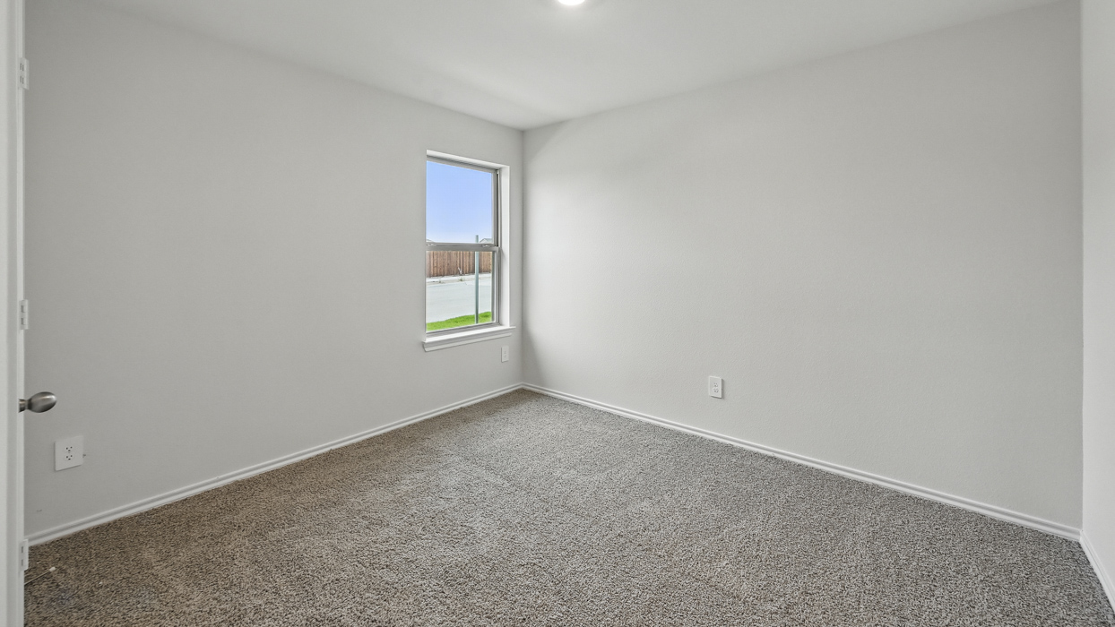 bedroom two with light grey carpet
