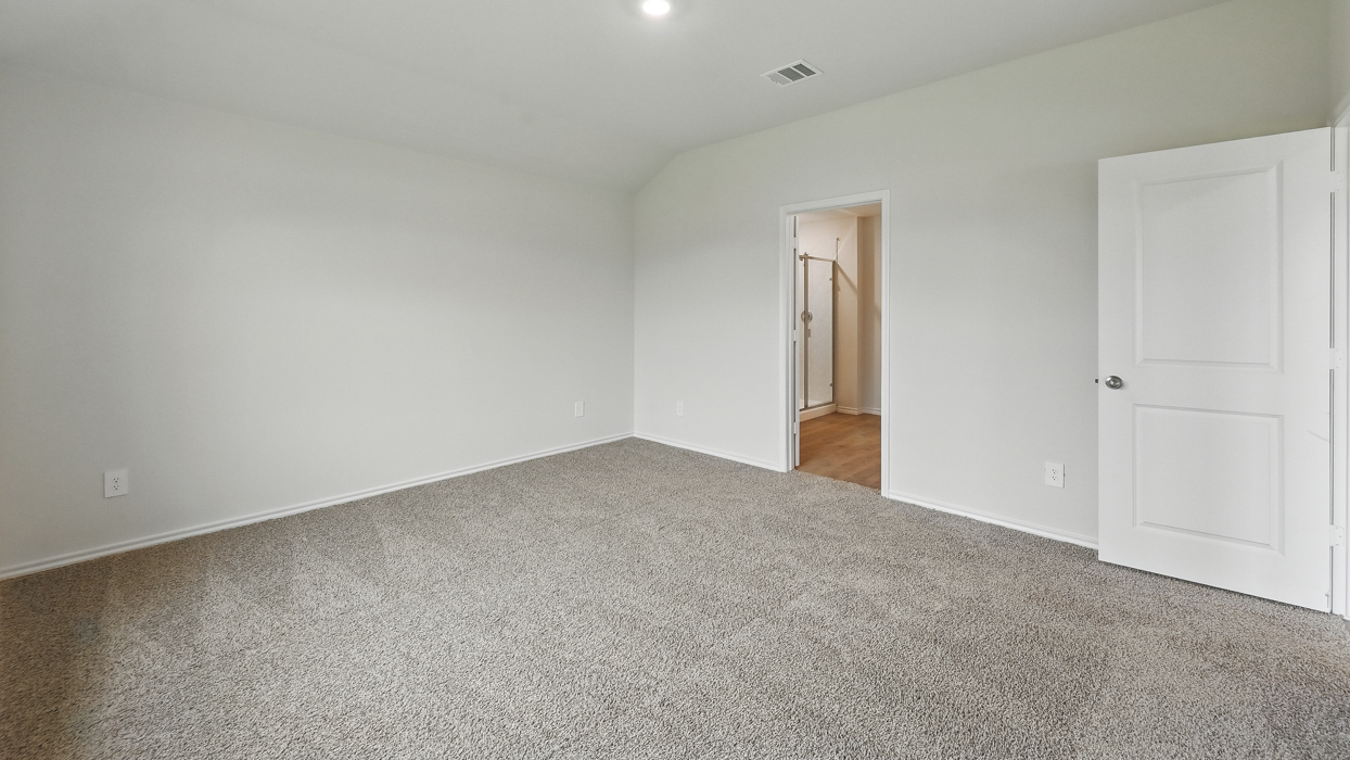 rimary bedroom with light grey carpet
