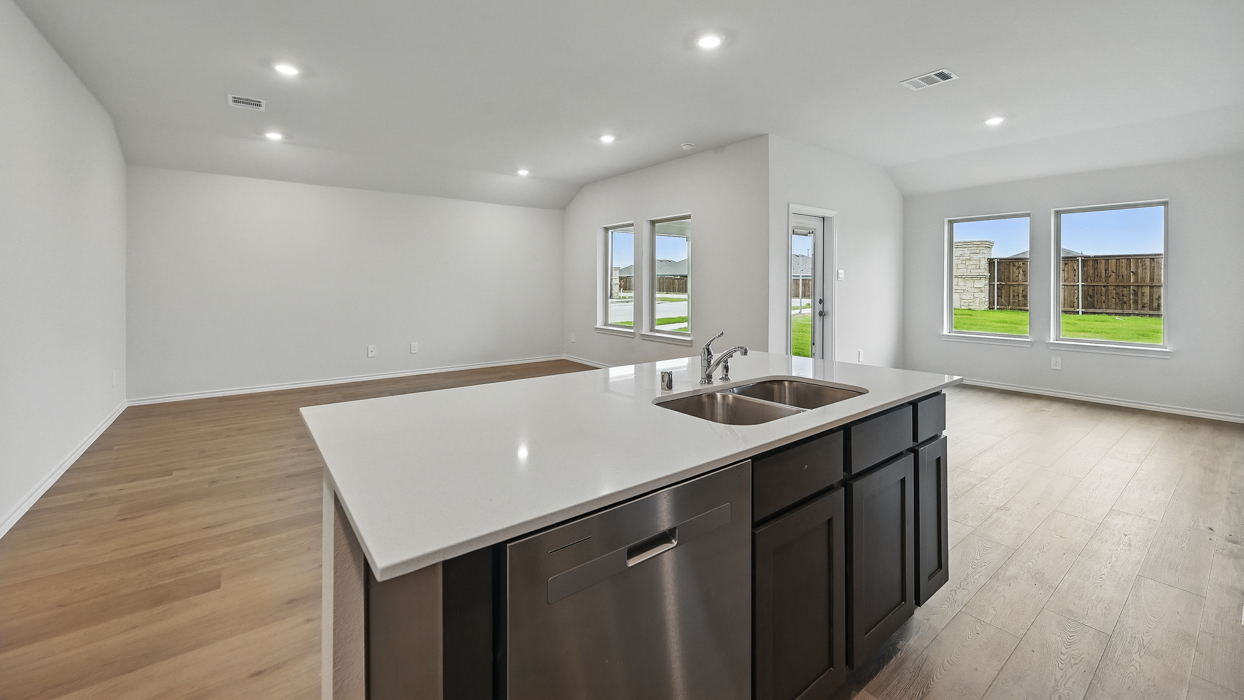 kitchen and living room view with hardwood flooring