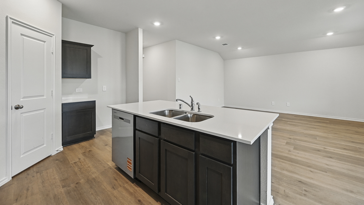 kitchen and living room view showing entry hallway