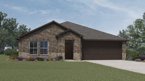 the exterior of a home with light brown brick