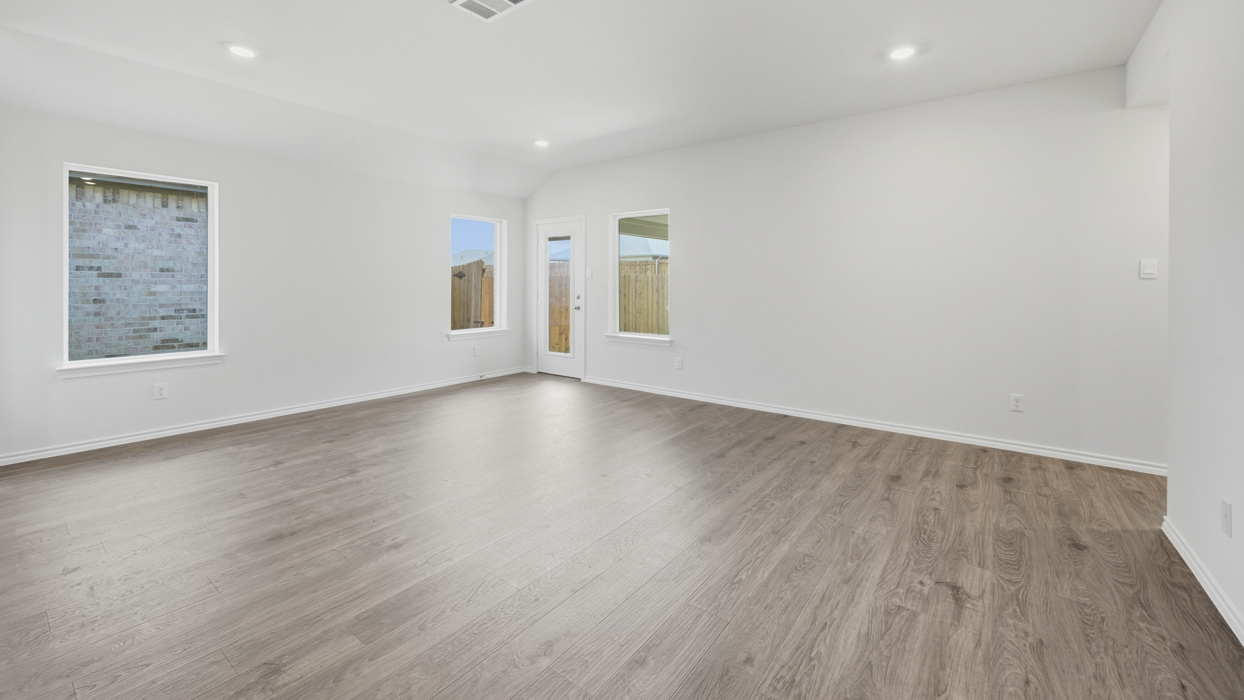 living room overview showing natural light and hardwood floors