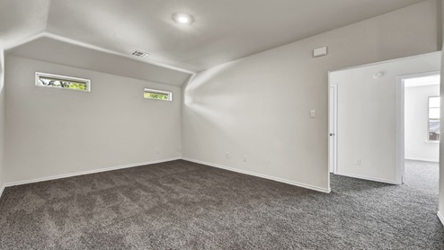 upstairs gameroom with gray carpet and white walls