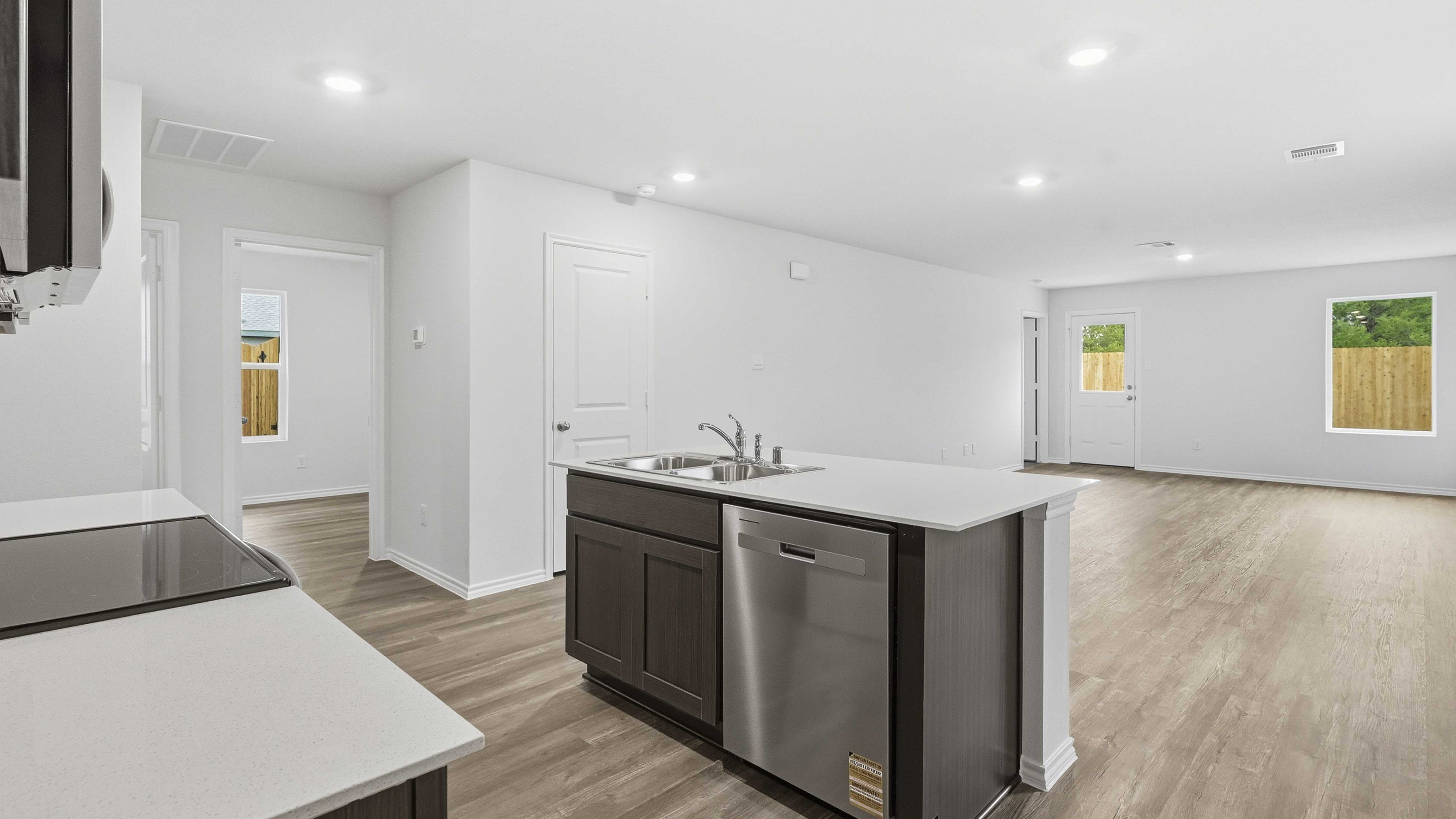 kitchen and living area with hardwood floors