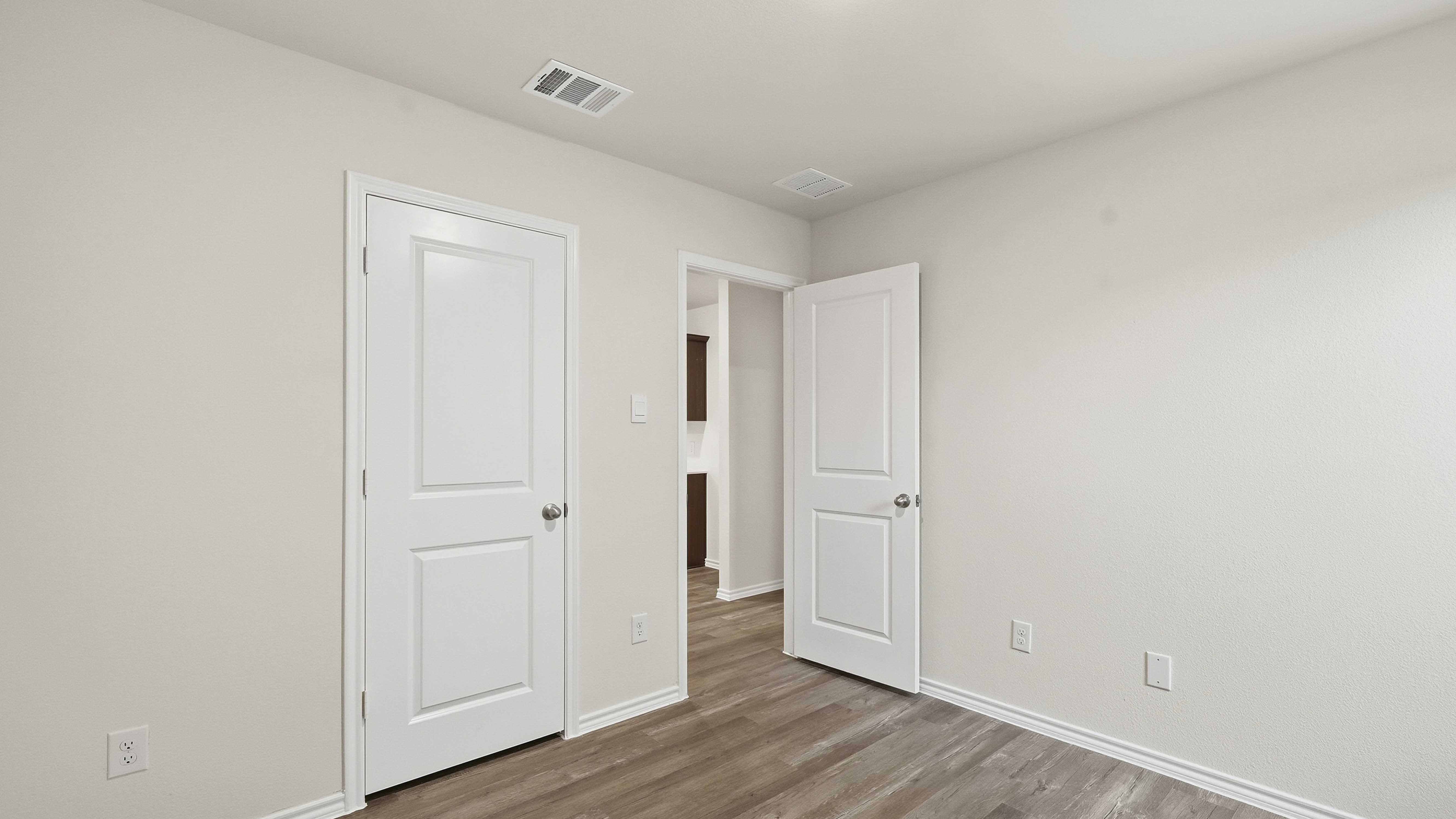 secondary bedroom with hardwood floors