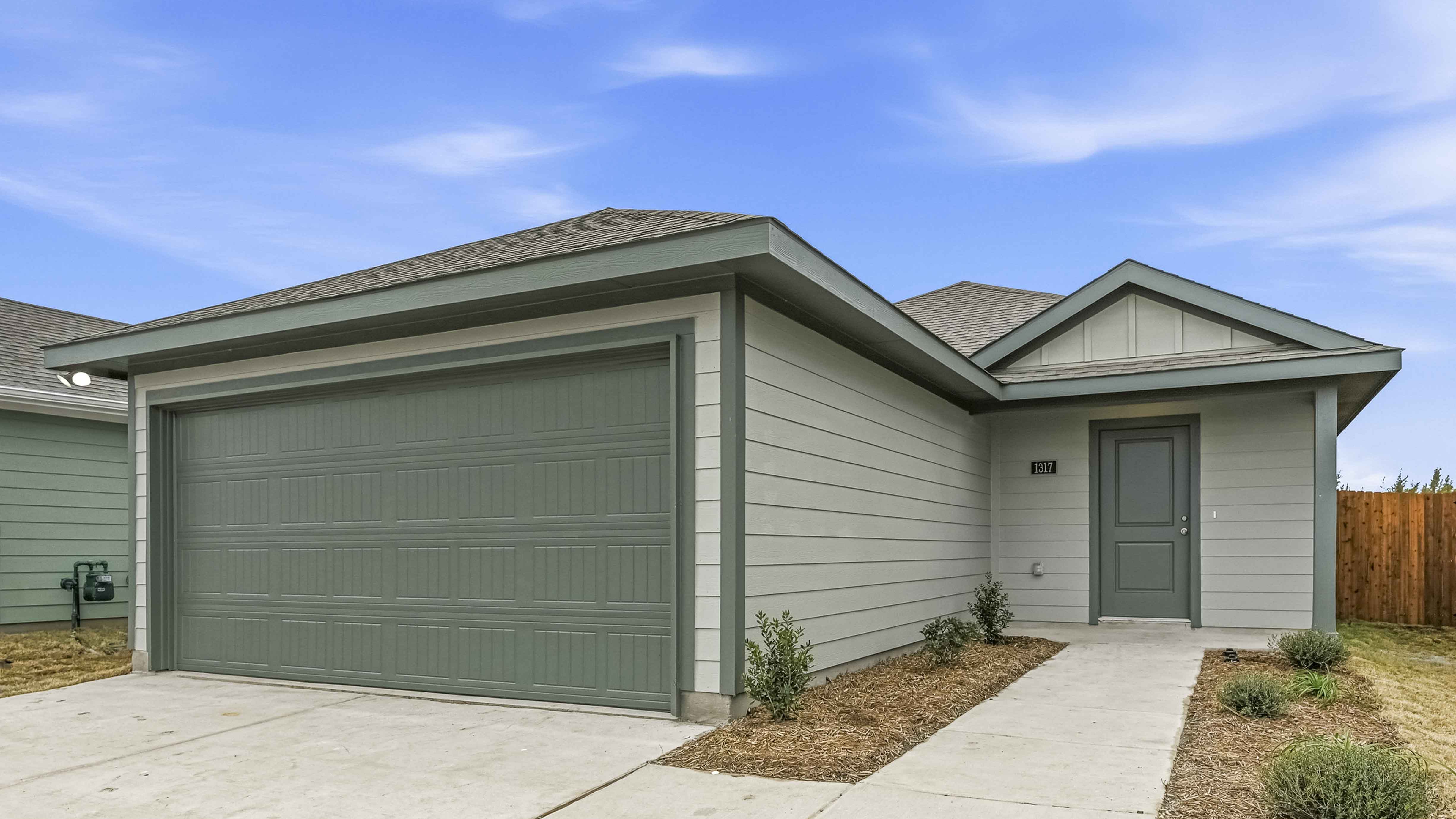 exterior of one story home with siding