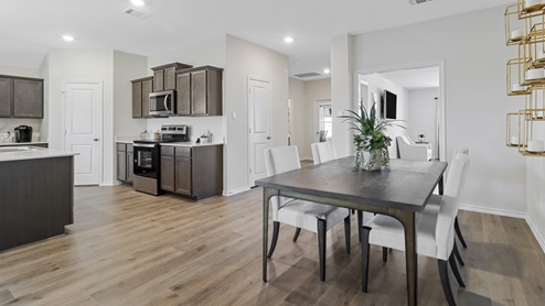 Open concept breakfast nook and views into the kitchen